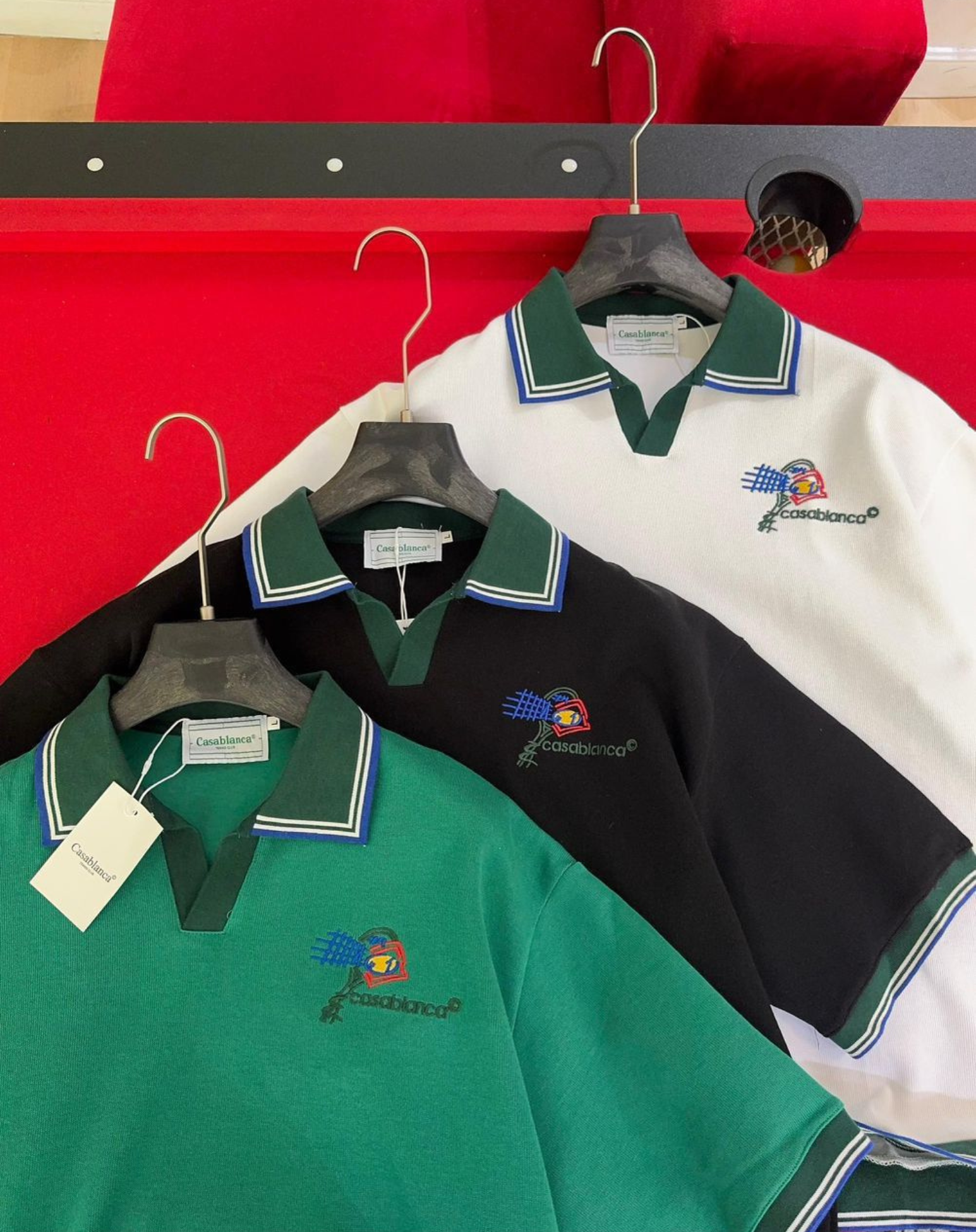 Casablanca Polo Shirts in green, black, and white.